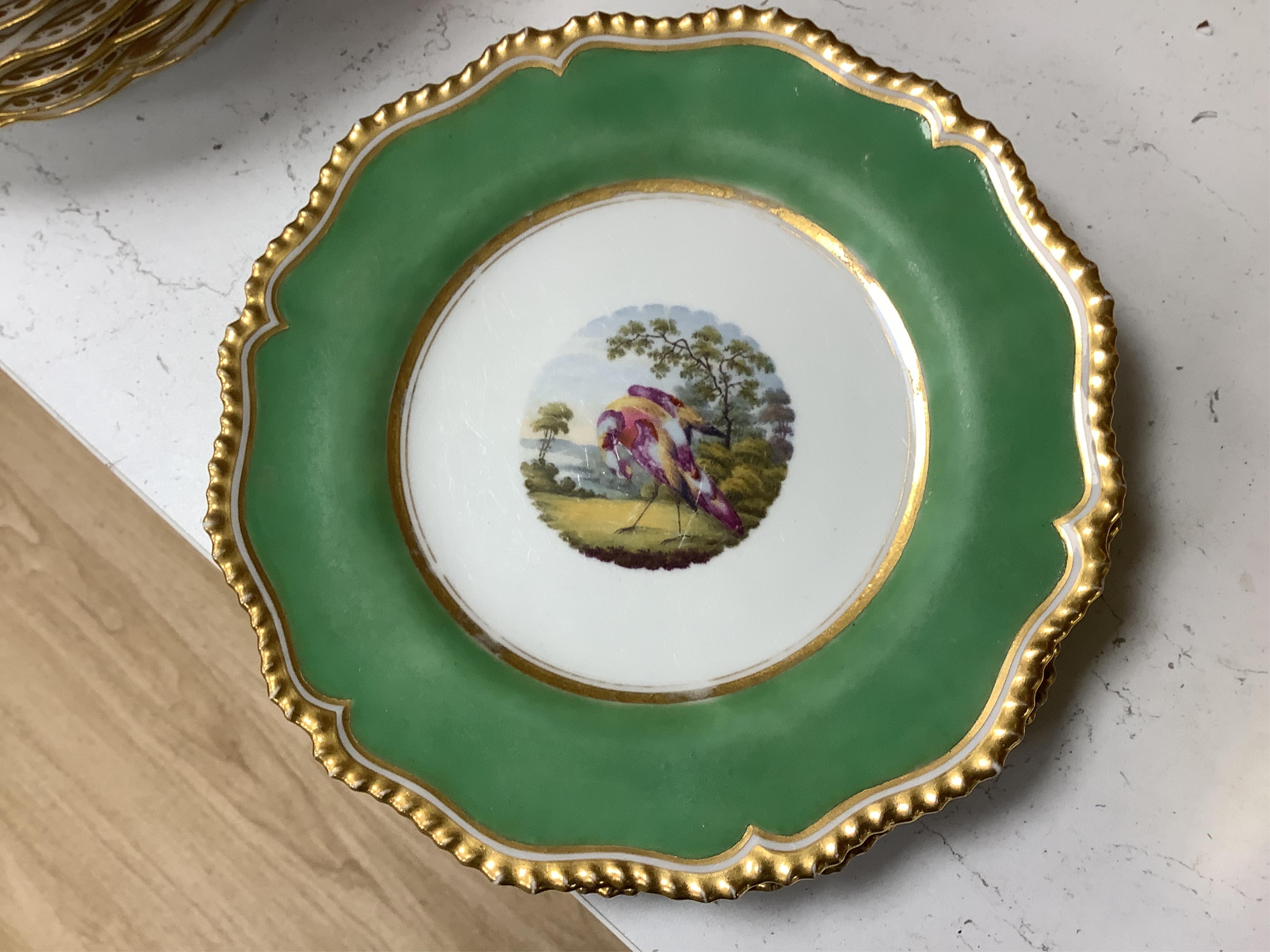A collection of 19th century English dessert wares to include a pair of Flight, Barr and Barr ‘fantastic birds’ green ground dessert plates, various Ridgway dessert plates, five Minton botanical plates with tooled gilt b